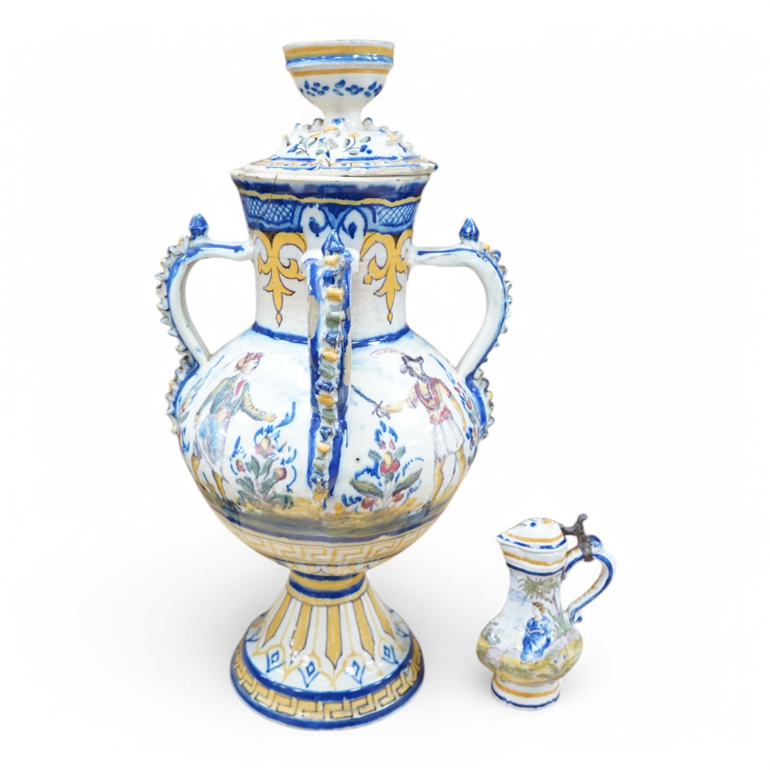 A 19th century faience lidded vase and a later small jug, tallest 49cm. Condition - poor to fair